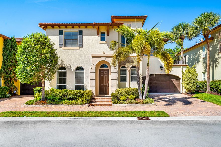 This beautifully updated two story end unit villa lives like a private single family home, offering over 2,400 square feet, 3 bedrooms, and parking for up to 4 vehicles. Perfectly positioned directly across from the pool in one of Boca Raton's hidden gem communities, the residence blends privacy, timeless finishes, and effortless living.  Southern front exposure fills the home with natural light through impact windows and doors, highlighting timeless Saturnia marble flooring, elegant moldings, and a warm wood staircase. Upstairs, 10 foot ceilings enhance the airy feel, while the current office setup includes its own closet. The primary suite features dual vanities, a linen closet, spacious walk in closet, jetted tub, separate shower, and a private terrace surrounded by lush greenery. Outdoor living is equally inviting with sealed travertine flooring, a pergola covered entertaining area, built in BBQ, cold plunge, and exceptional privacy.  Additional highlights include a newer AC approximately 18 months old, Nest climate control, epoxy finished garage with sauna, powder bath, and extra storage. The HOA is exceptionally well run with strong reserves and covers the roof, exterior, landscaping, and building insurance for easy, low maintenance living.  A rare turnkey villa that offers the space and comfort of a home with the convenience of luxury maintenance free living.  The information published and provided including but not limited to prices, measurements, square footages, lot sizes, features, finishes, and calculations are subject to errors, omissions or changes without notice. All such information should be independently verified. All parties should perform their own due diligence to verify all information.