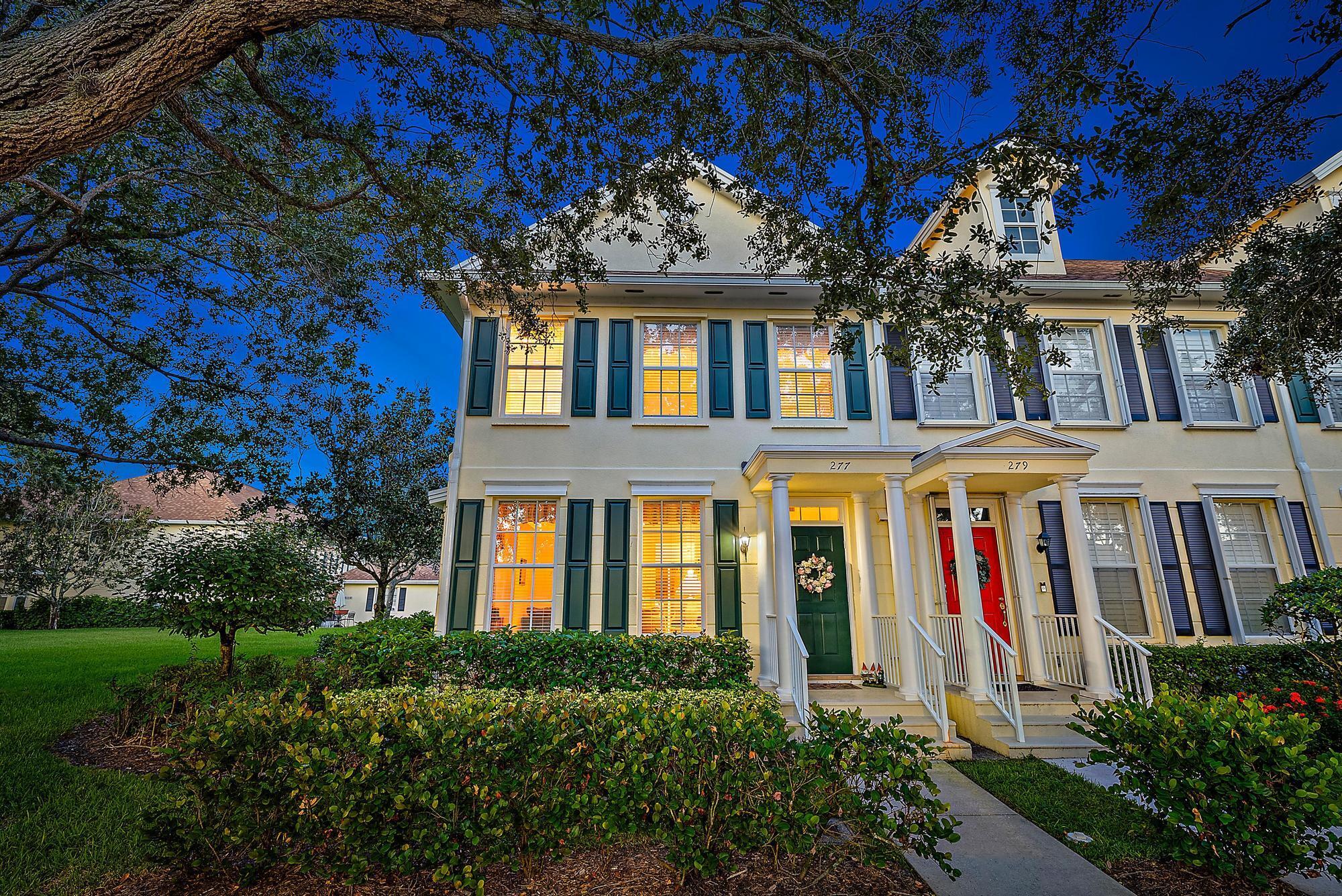 EXQUISITE three-bedroom, two-and-a-half-bathroom townhouse with 1,812 square feet of living space, located in the highly sought-after New Haven community in Abacoa. Built in 1999, this home features an inviting open-concept kitchen, a desirable floor plan, and an abundance of natural light. Additional highlights include a screened outdoor patio and an attached two-car garage, all in a picturesque neighborhood with tree-lined streets and low HOA fees. Step inside to a welcoming foyer that opens to the spacious living and dining areas. The open layout creates a seamless flow, perfect for entertaining or everyday living. Large windows fill the space with light, while neutral tile and carpeting provide a comfortable, versatile backdrop for any decor style. The open-concept