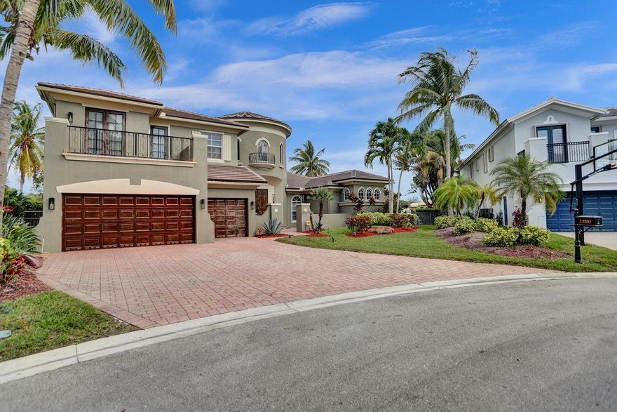 Back on market! Truly outstanding home on one of the premier lots in all of Heron Bay. Soaring ceilings, Grand wrap-around staircase and impact windows greet you the moment you walk in. Marble floors throughout lead you to a huge chef's kitchen and oversized family room. The first-floor master suite will satisfy any need with its sitting area, oversized closets, or the sumptuous bath. Another ensuite bedroom and office on the main level, plus 4 additional large bedrooms and recreation room fill the upper level. Fully shaded outside patio overlooks one of the largest yards and pools in Heron Bay. The fully fenced yard is perfect for kids and pets. The two community clubhouses, abundant recreation areas, and guard gated entrance make this one you can't miss! Sellers prefer summer closing