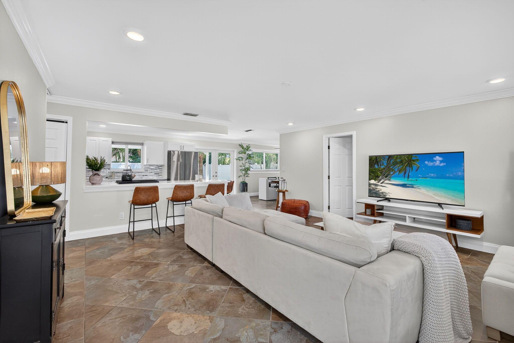 Welcome to this beautifully updated 3-bedroom, 2-bath single-family home offering over 1,400 sq ft of bright, comfortable living--with no HOA restrictions. Located in the heart of Palm Beach Gardens, this move-in ready home is filled with thoughtful updates and everyday comforts.Step inside to a light-filled interior featuring an updated kitchen equipped with stainless steel appliances and a gas stove, perfect for cooking and entertaining. The home also features impact windows and doors, a spacious layout, and numerous recent upgrades including a brand-new metal roof (2024), new gas water heater (2025), and updated A/C (2024). The exterior has been freshly painted, and the backyard fence has been replaced for added privacy.