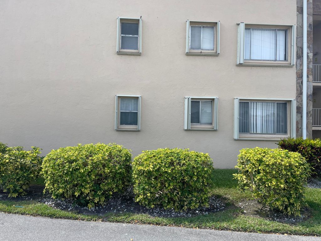 Photo of 700 Village Green Court #101, Palm Springs, FL 33461 (MLS # B26031117)