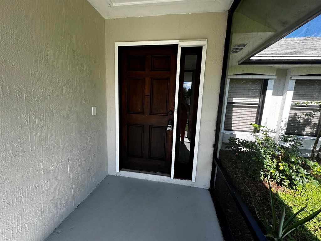 Photo of 2562 SW Kenilworth Street, Port Saint Lucie, FL 34953 (MLS # R11022716)