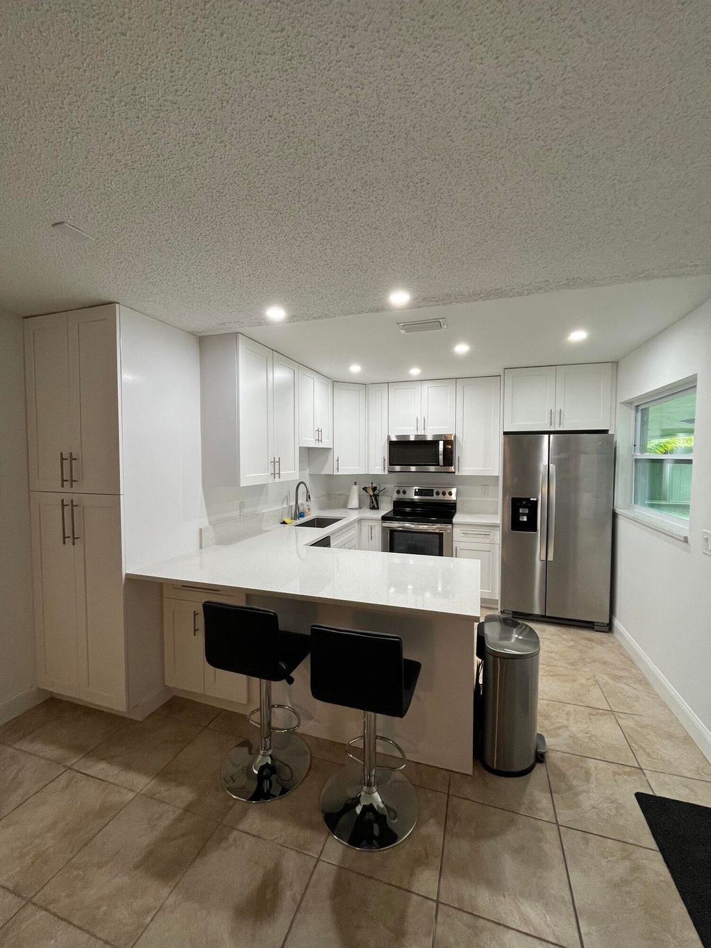 Photo of 1979 Juno Road, North Palm Beach, FL 33408 (MLS # B26018482)