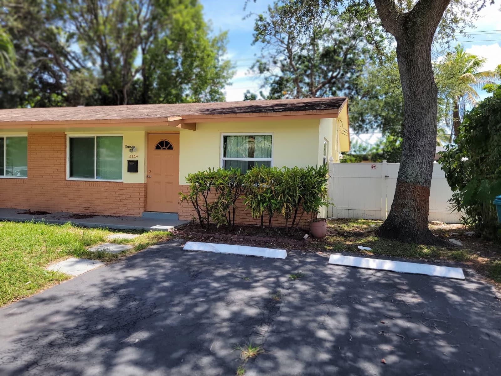 Spacious 2-bedroom rental in prime Lauderhill location! This clean, move-in-ready unit offers everything you need for comfortable living! Step into a bright, oversized living area with sleek tile flooring throughout. Complimented with a modern bathroom, which adds a stylish touch. Enjoy an upgraded kitchen with granite countertops and stainless steel appliances. Both bedrooms are generously sized with plenty of natural light and ample closet space. Bonus enclosed patio includes in-unit washer and dryer—ideal for storage, gym, or relaxation. Enjoy a large private backyard that makes this unit feel like home, and a cozy front porch with private entrance. Conveniently located near shopping, dining, schools, and major highways. Fast approval—no HOA delays-ready for immediate move-in!