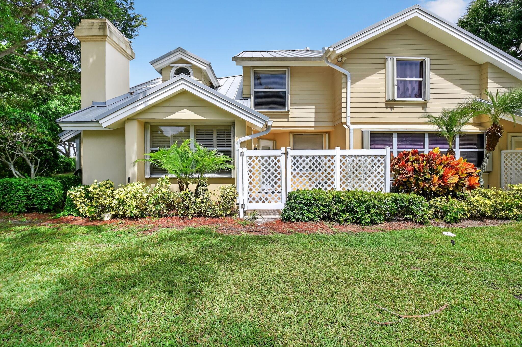 PERFECTION AWAITS YOU. LOCATED IN A PRIVATE CORNER OF THIS WELL MAINTAINED COMMUNITY, YOU WILL FIND A FRESHLY PAINTED UNIT WITH NEW SOARING KNOCKDOWN CEILINGS. THE UPDATED KITCHEN BOAST 48'' WHITE CABINETS, GRANITE COUNTERS, AN ISLAND & A LARGE PANTRY. LAMINATED WOOD FLOORS THRUOUT & BOTH BATHROOMS HAVE BEEN UDATED. THE 1 BEDROOM DOWNSTAIRS OFFERS THE FLEXIBILTY OF BEING THE PRIMARY, OR GUEST, YOU CHOOSE. OUTSIDE ENJOY THE FRONT PORCH, OPEN PATIO, OR THE SHADE OF A NATURE LOVING MATURE TREE, TOTALLY RELAXING & NO PARKING LOT TO LOOK AT! EASY TO CALL THIS ONE HOME W/O THE MAINTENANCE OF THE EXTERIOR OR ROOF, LANDSCAPE OR EXT INSURANCE SINCE THE HOA COVERS IT & A 24 HR MANNED GATE. STORM READY WITH ACCORDIAN SHUTTERS. AMMENITIES; COMM POOL, JACUZZI, TENNIS, PICKLEBALL & KIDS PLAY YAR