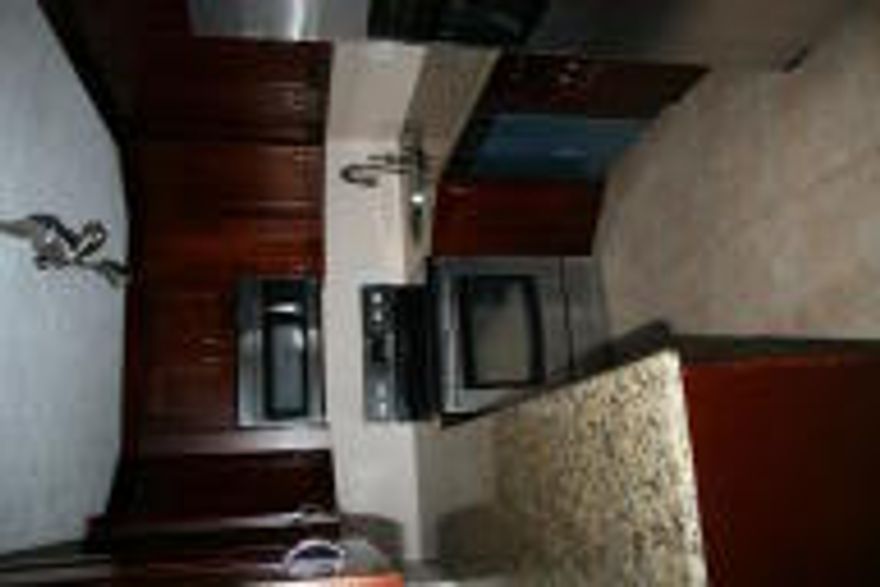 Nicely renovated 2/2 ground floor unit.   Tile throughout living space and laminate wood flooring in bedrooms.  Updated kitchen with granite and stainless steel appliances.  The bathrooms have been updated also.  Front load washer and dryer.  Palm Club is a gated community that offers tennis courts, pool and a club house.  Basic cable and water are included.