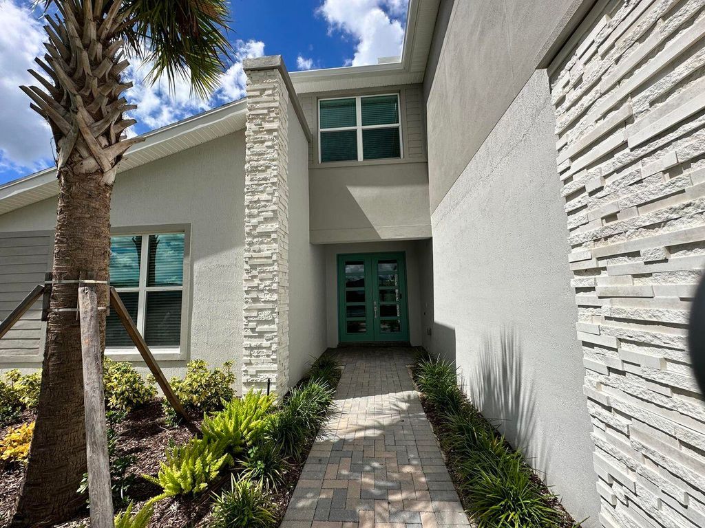 Photo of 10710 SW Hensley Street, Port Saint Lucie, FL 34987 (MLS # R11166895)