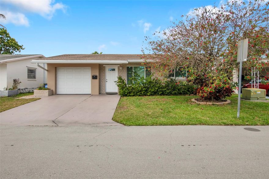 Come see this gorgeous home in Mainland 55+ community. This home has it all and is priced fairly against the community competition. You will see the home and property will blow away your clients. The curb appeal and lot are professionally landscaped. The home has beautifully been updated with newer kitchen appliances, quartz counters, bathroom, high impact windows, flooring throughout, Roof is only 7 years old. AC- 2013 but maintained and runs efficiently. Enjoy your favorite beverage and company on the enclosed 4 year old porch with canal views! Features a tankless hot water heater installed in 2022. Full size washer and dryer. Be the first to show! Will not last! No aggressive dog breeds, 2 pets allowed per household. No parking on grass.The community is a 55+ community.