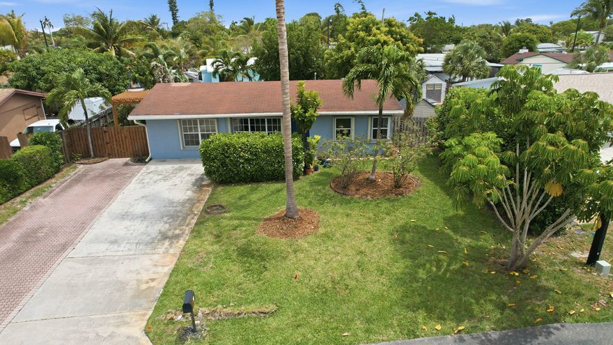 Move right into this picture-perfect, updated 3-bedroom, 2-bath home situated on a quiet street in a fantastic location. This beautifully maintained home is loaded with upgrades, including a renovated kitchen with granite countertops and stainless steel appliances, tastefully updated bathrooms, a new electrical panel, and a newer 2023 A/C system. Additional features include partial impact windows, full accordion storm shutters, tile flooring throughout, a split-bedroom floor plan, a fully fenced yard, and a huge oversized driveway with plenty of parking. Enjoy the freedom of no HOA while being conveniently located close to beaches, golf courses, shopping, restaurants, and houses of worship. This is the perfect place to call home!