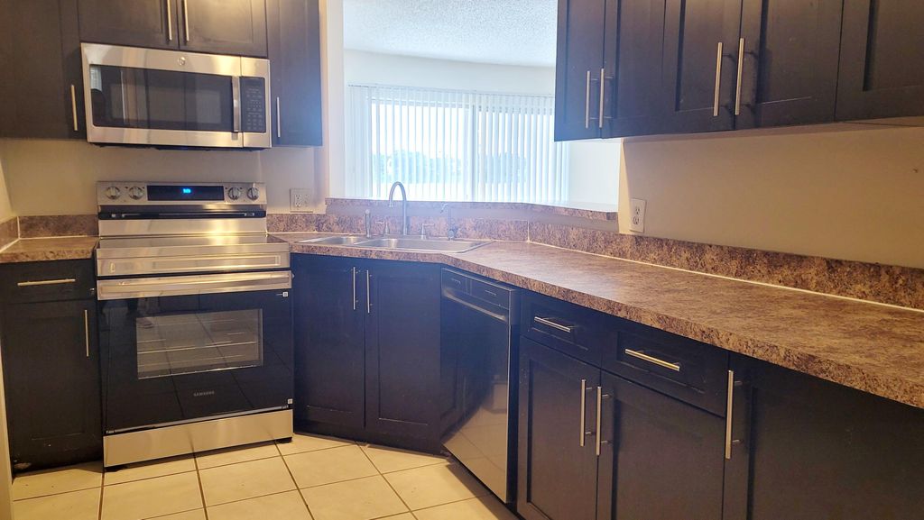 Photo of 3433 NW 44th Street #103, Oakland Park, FL 33309 (MLS # B26019934)