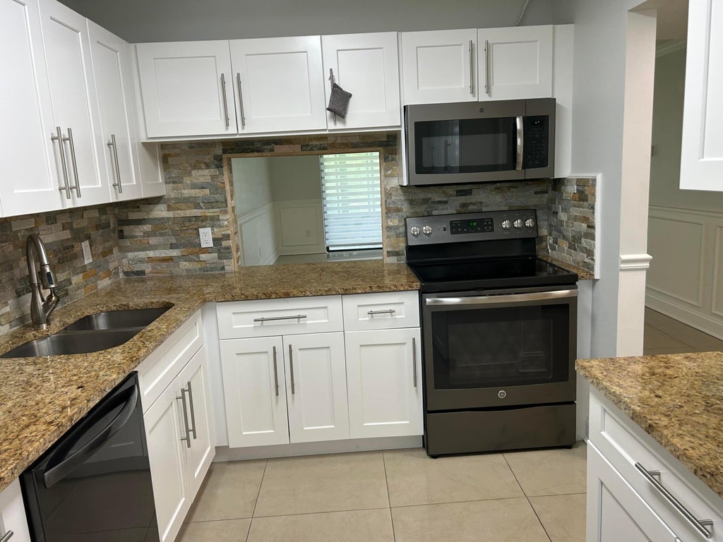 Photo of 140 Lake Nancy Lane #115, West Palm Beach, FL 33411 (MLS # B26042105)