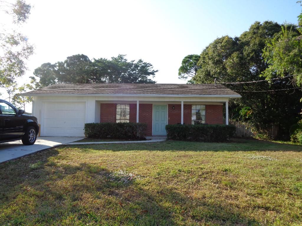 Photo of 712 NW Avens Street, Port Saint Lucie, FL 34983 (MLS # R11157176)