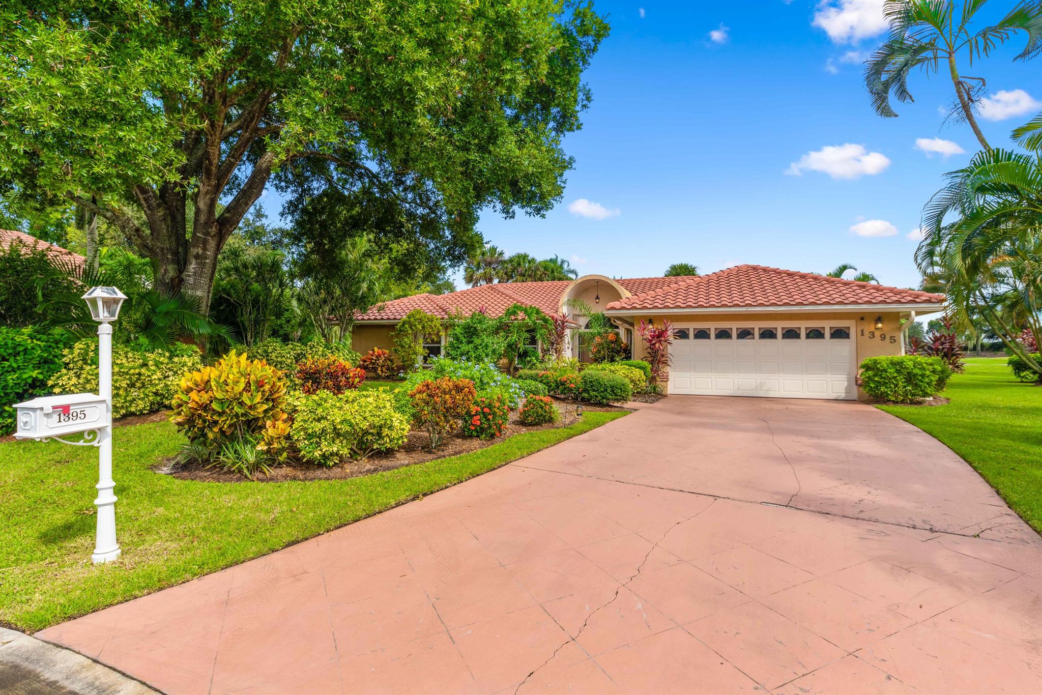 Welcome to this beautifully landscaped 4 bedroom, 2 bath home nestled on over half an acre in the sought after Country Club Estates. Located on a peaceful cul-de-sac, this property offers stunning views of the 4th hole of the golf course from the large screened in covered patio. Inside, you'll find a spacious kitchen with granite countertops and stainless steel appliances, along with both living and family rooms. The generous master suite features a large ensuite bath, while the updated guest bathroom adds a modern touch. With plenty of room to add a pool or expand, this home offers endless possibilities. Additional features include a laundry room with pantry cabinets and a 2-car garage. Enjoy the best of golf course living in this serene and private setting. New Roof in 2022