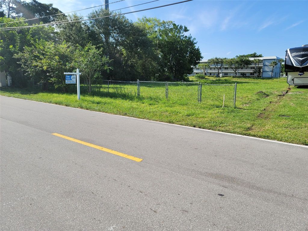 Photo of 5611 NW 77th Ct, Coconut Creek, FL 33073 (MLS # F10358401)