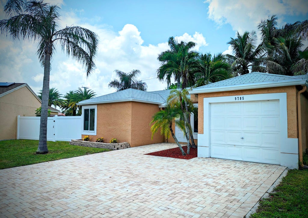 Photo of 9785 RIDGECREEK Road, Boca Raton, FL 33496 (MLS # B26052612)