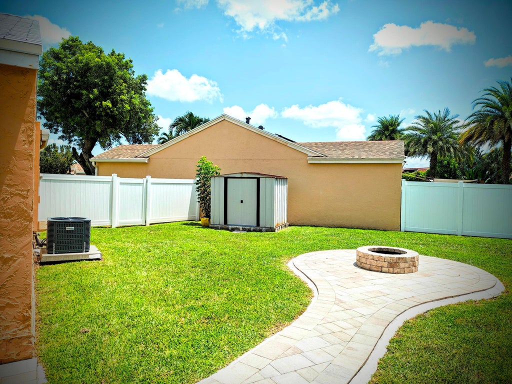 Photo of 9785 RIDGECREEK Road, Boca Raton, FL 33496 (MLS # B26052612)