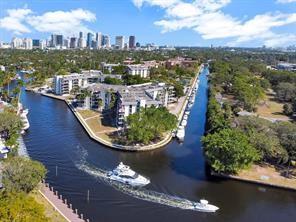 YOUR VERY OWN PIECE OF PARADISE! 2 BEDROOM, 2 BATH 1,250 SQ FT CONDO IN A GATED WATERFRONT PRIVATE ISLAND IN THE HEART OF FORT LAUDERDALE! EXPANDED OPEN KITCHEN W/STAINLESS STEEL APPLIANCES LEADS INTO LARGE LIVING ROOM/DINING AREA. BEAUTIFULLY REMODELED BATHROOMS & COVERED PARKING FOR YOUR CAR MAKE THIS A COMPLETE PACKAGE READY FOR NEW OWNER, ALONG WITH A DOWNTOWN SKYLINE/CANAL VIEW! NEW IMPACT GLASS WINDOWS & DOORS, NEW BALCONY RAILINGS, CONCRETE RESTORATION, EXTERIOR PAINT & MORE ALL PAID BY SELLER! NO FIXED BRIDGES, OCEAN ACCESS DOCKAGE TO 50' AS AVAILABLE AND 2 PETS UNDER 20 LBS EACH PERMITTED, TOO! GATED WATERFRONT ISLAND WITH 24 HR MANNED GUARDHOUSE, HEATED POOLS, TENNIS, PICKLEBALL, FITNESS CENTER & KAYAK/PADDLEBOARD RACKS. MINUTES TO DOWNTOWN/LAS OLAS, BEACHES, SHOPPING & MORE!