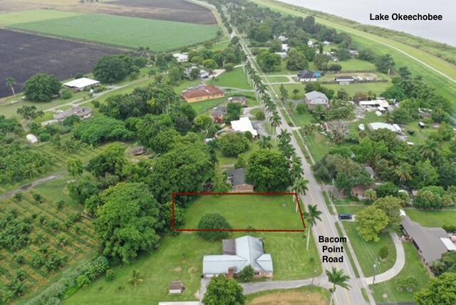 This property is a perfect location to custom build your home or vacation home with beautiful sunsets from your front porch. This 0.40 acres of land Is located on Bacom Point Road which is known for its spectacular line of palm trees up and down the road. This property is located near Lake Okeechobee. There is a Marina located in town where you can fish on the pier or put your boat in and go for a spin. This could be a fisherman's dream location.