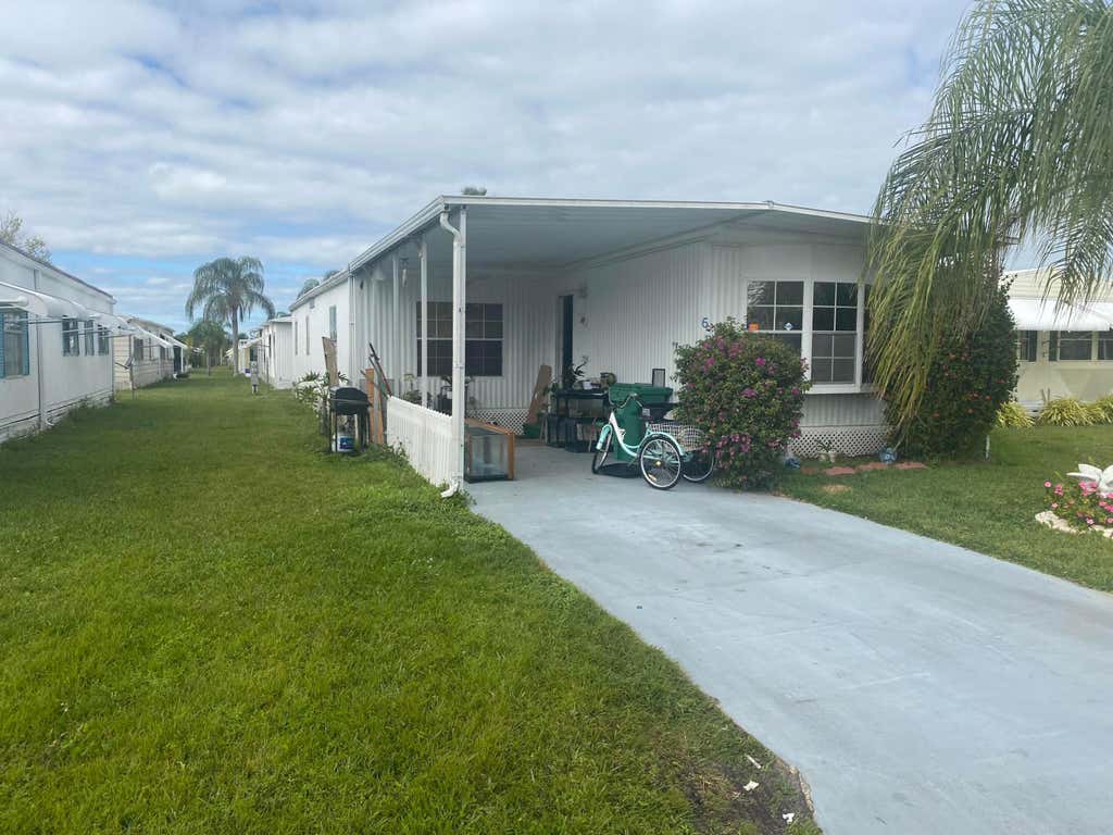 Photo of 6 Nuestra Calle Lane, Port Saint Lucie, FL 34952 (MLS # R10959034)