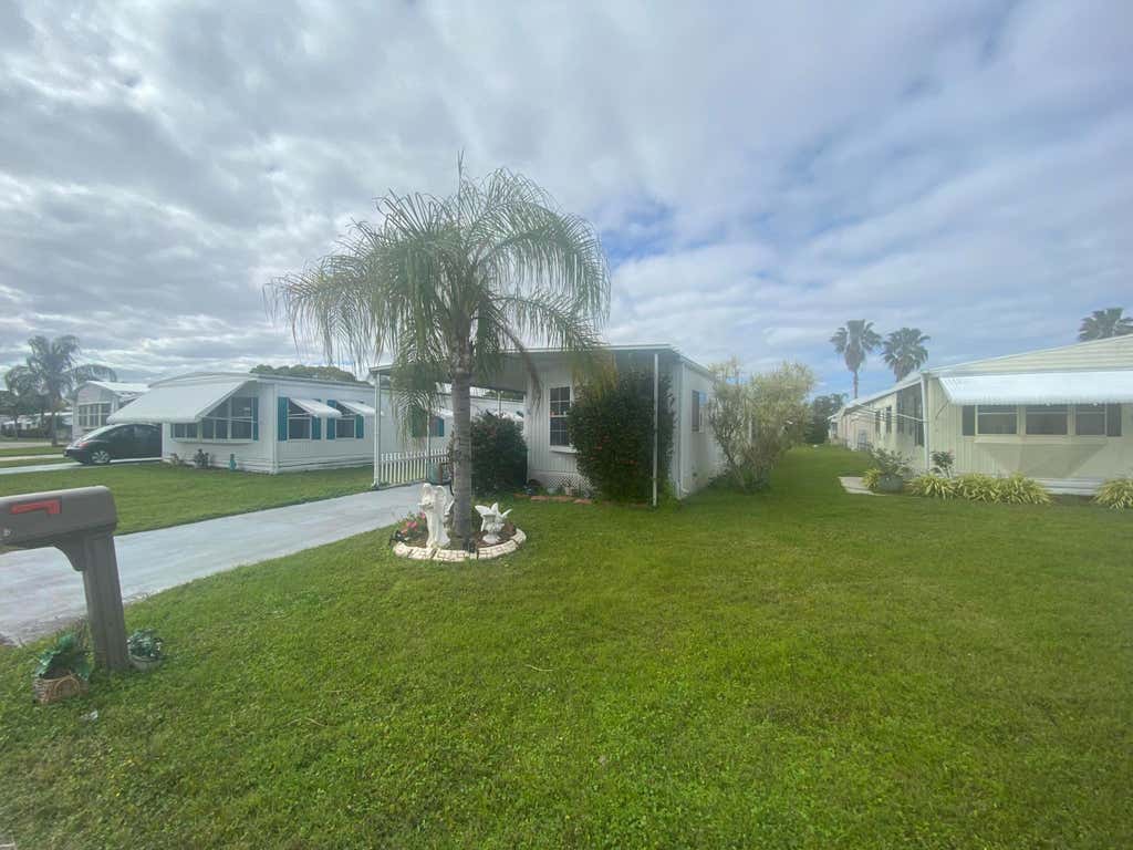 Photo of 6 Nuestra Calle Lane, Port Saint Lucie, FL 34952 (MLS # R10959034)