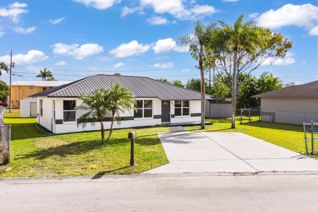 Photo of 603 SW 10th Street, Belle Glade, FL 33430 (MLS # R11157722)