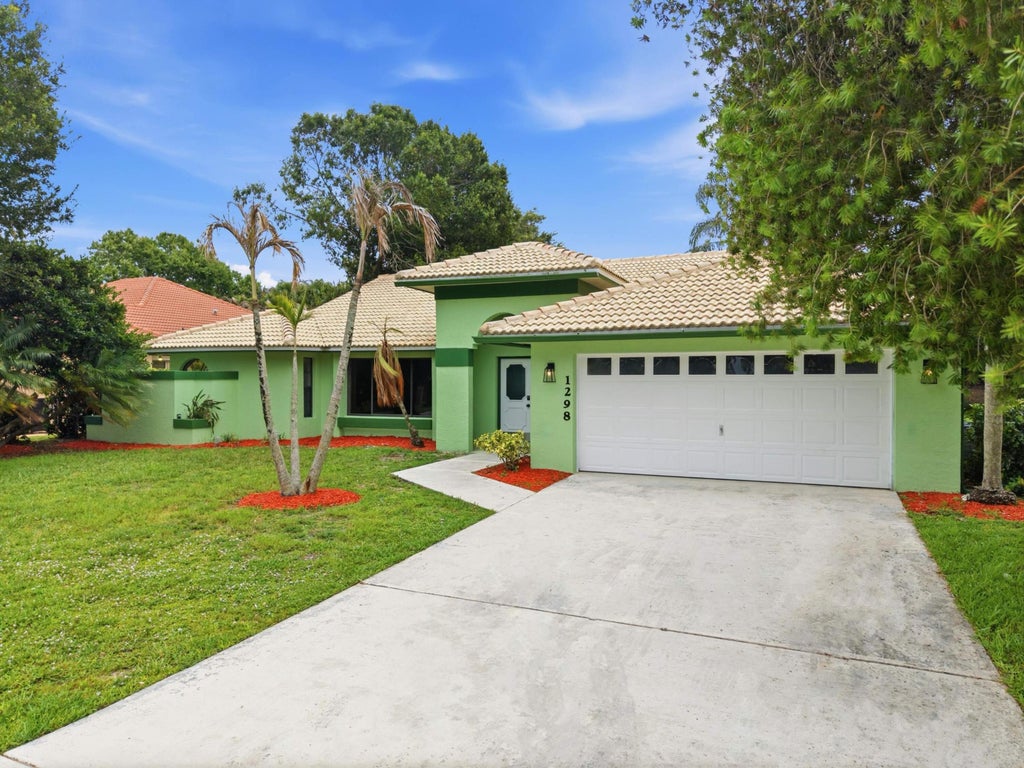Photo of 1298 SW Cedar Cove, Port Saint Lucie, FL 34986 (MLS # B26039664)