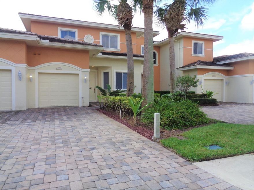 Beautiful townhome, 1,882 SF nicely upgraded, newer kitchen cabinets, new AC, travertine tile on first floor & beautiful hardwood bamboo flooring in other areas and bedrooms. 4 bedrooms, 2.5 baths, 1 car garage. Calming lake views from back covered porch, master and bedroom upstairs. Master bedroom on first floor and 3 bedrooms upstairs. 2 cars max restricted. Master bath with bathtub, separate shower, two vanities, two walk-in Closets. Gated community offers heated pool, preserve areas, sidewalks. Located near schools, shopping, grocery stores, restaurants, parks, intergenerational center with various activities, beaches and much more.