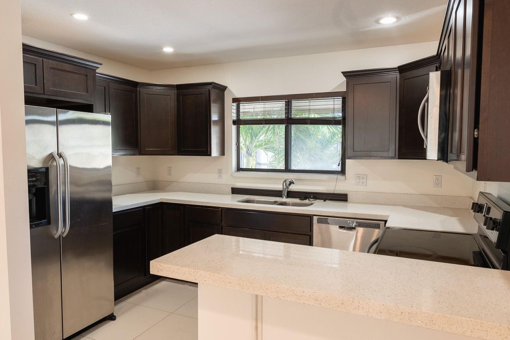 Photo of 1665 Cabot Lane #A4, Wellington, FL 33414 (MLS # B26028173)