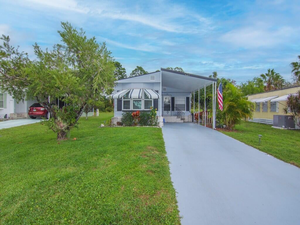 Photo of 61 E Caribbean, Port Saint Lucie, FL 34952 (MLS # B26080985)