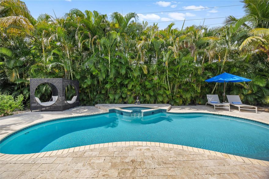 Located in desirable Coral Ridge and the Bayview Elementary school district, this fully renovated 3BD/3BA furnished home features a new 2024 roof, porcelain tile flooring, updated kitchen and baths, impact windows, and fresh interior paint. Southern exposure fills the bright open layout with natural light. The modern kitchen offers stainless steel appliances, double ovens, and a wine cooler—perfect for everyday living and entertaining. The spacious primary suite includes a beautifully updated ensuite bath. Enjoy a private fenced backyard retreat with pool, hot tub, oversized infrared sauna, outdoor shower, BBQ area, and lush landscaping. Ideally located just ¼ mile to Publix, Starbucks, and Galleria Mall, and approximately ½ mile to the beach. Truly move-in ready coastal living.