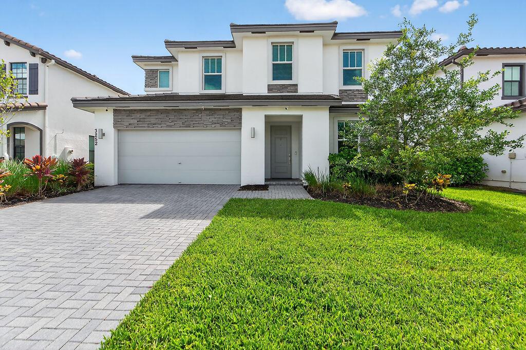 Welcome to this meticulously maintained single-family residence, built in 2019, offering the perfect blend of contemporary design, upscale finishes, and everyday comfort. Spanning 2,500 square feet of bright and open living space, this 4-bedroom, 3.5-bath home is truly move-in ready and designed for both style and function. Step inside to discover a thoughtfully updated interior, where abundant natural light highlights the spacious open-concept layout. The gourmet kitchen, elegant living areas, and serene bedrooms flow seamlessly, creating an inviting atmosphere for entertaining or relaxing. Every detail reflects quality craftsmanship--from the sleek, impact-rated windows to the pristine 2-car garage with epoxy flooring.