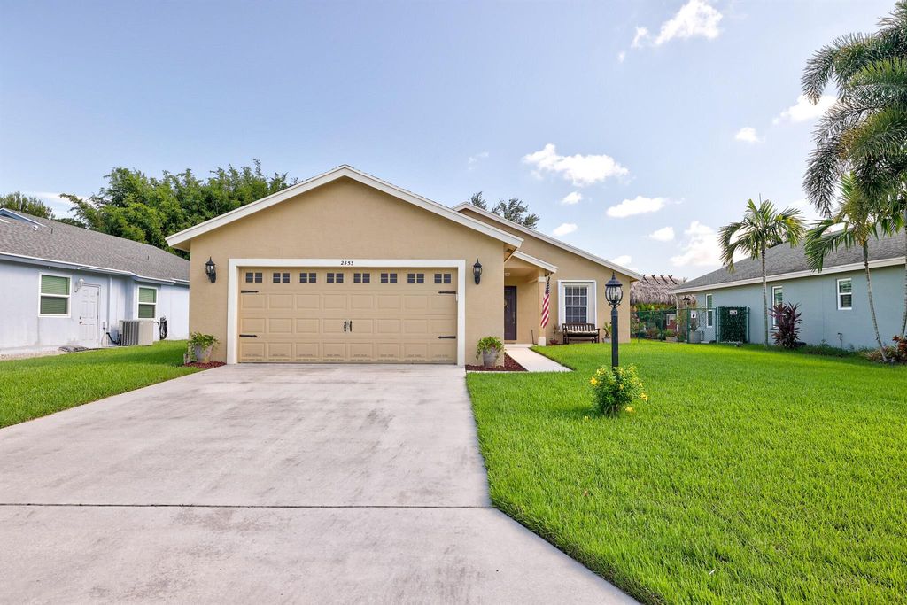 Photo of 2553 SW Regency Road, Stuart, FL 34997 (MLS # R10908719)