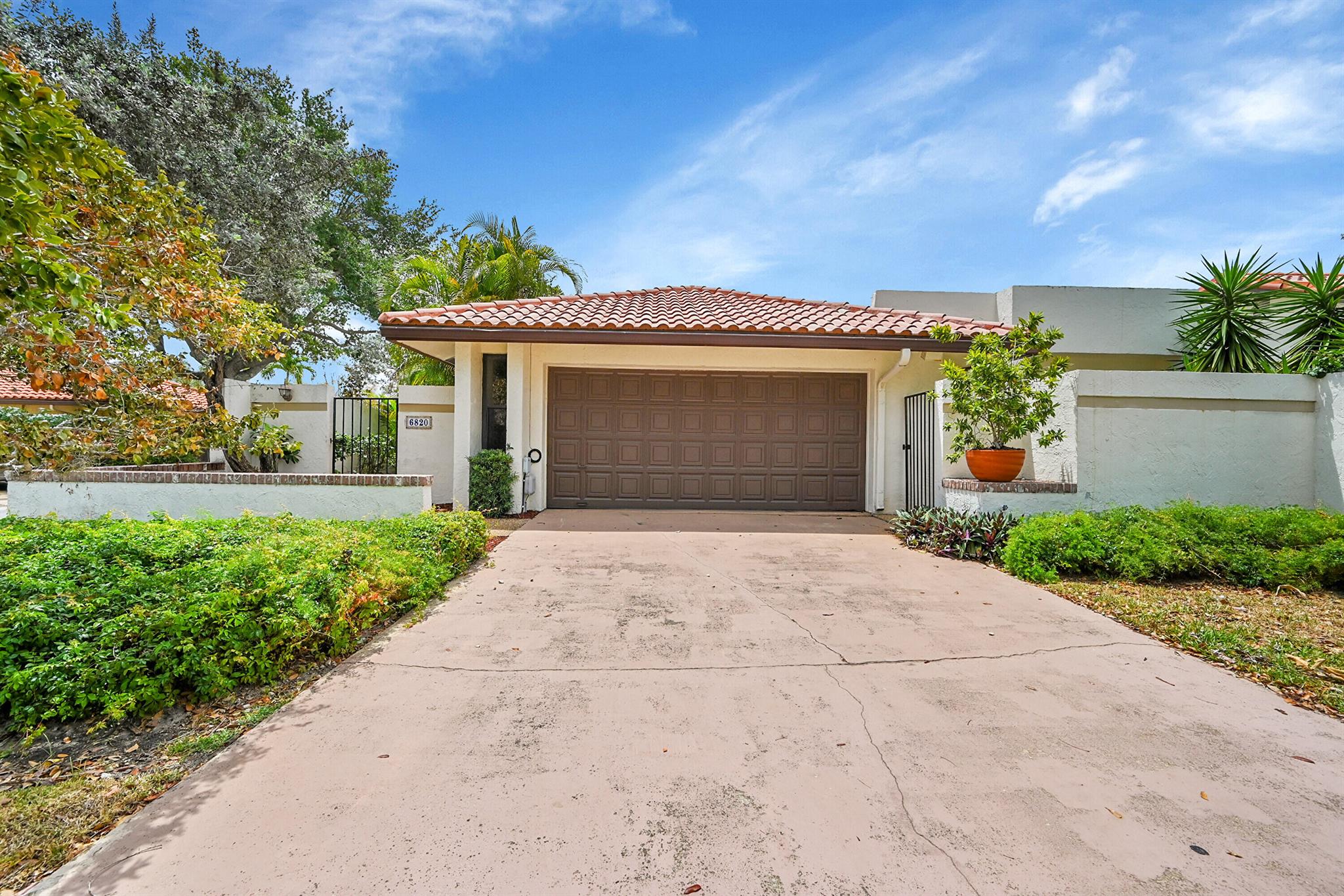 Discover timeless Old Spanish charm in this beautifully upgraded Mediterranean-style 2-bedroom, 2-bath home, ideally situated on a quiet interior corner lot in the gated, all-ages community of Pradera, in the heart of Boca Raton.