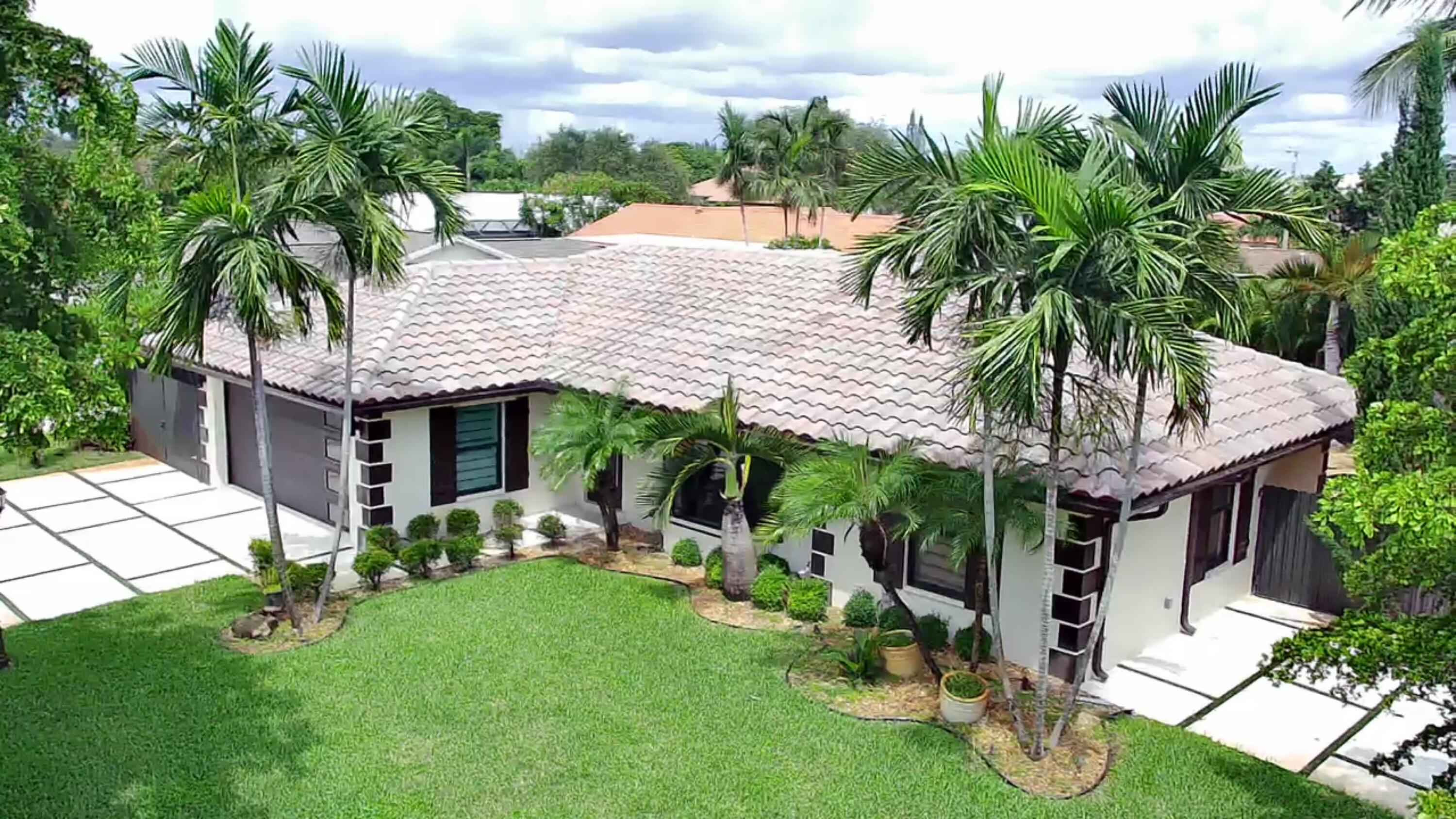 This pool home is a must see. CBS built with two car garage and tile roof. Open and bright along with a modern floor plan. Beautiful backyard, with a heated pool and hot tub, gazebo and outdoor kitchen. Kitchen has stainless steel appliances, tumbled marble back-splash that overlooks Florida room. Updated baths, built-in-book shelves, French door sliders, upgraded lighting and designer drapery add to the elegance and charm of this home. Pool has in-ground spa attached. Large Florida room/TV room has Spanish tile, lots of windows, tile floor with views of pool and patio area.