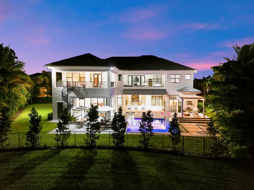 Expanded Vanderbilt Grand w/ 800K of upgrades on a 3/4 acre lush private lakefront lot. Residence offers 6 bdrms plus Loft/Gym 8 full baths, 2 1/2 baths, 5 oversized garages, elevator, full house generator & impact windows. Modern floor plan w/ 24 ft foyer, winding wood staircase & floors. Main floor has a formal living room & dining room, a media room w/ wet bar & gaming area, office plus an en-suite bedroom. Modern kitchen opens to expansive family room w/ breakfast nook.
2nd floor has 5 expanded en-suite bedrooms w/ walk-in closets. master bedroom has private sitting area with his/her lavish bathrooms & walk in closets. Extras include summer kitchen, putting green, pergola w/ fire pit, steam shower, retractable doors w/ motorized privacy screens, spiral staircase from master balcony.