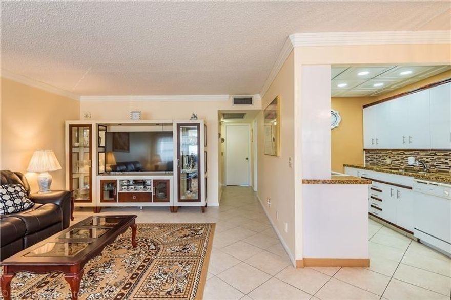 Beautiful Updated 2 Bedroom 1 1/2  Bath Second floor condo with amazing water views, steps to the pool with an assigned parking spot right outside the unit with plenty of guest parking. 55+ adult community.Century village has dancing, concerts, movies, billiards and other daily activities. Gated community has a free courtesy bus.Great Investment opportunity! Unit can be rented annually or seasonally.  There is tenant that is willing to stay or move out