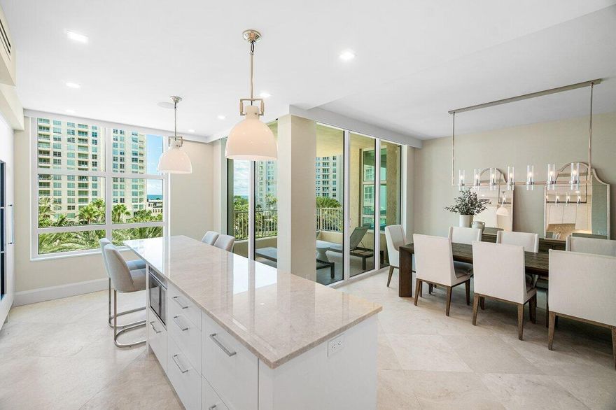 STUNNING PANORAMIC VIEWS OF THE INTRACOASTAL, CITY, LUSH GROUNDS WITH FOUNTAINS & OCEAN! THIS BEAUTIFULLY RENOVATED 2 BEDROOM 2 1/2 BATH APARTMENT WAS DESIGNED & DECORATED BY A TOP PALM BEACH FIRM! A EUROPEAN-STYLE SLEEK HIGH END KITCHEN WITH QUARTZITE COUNTERTOPS, AN OVERSIZED ISLAND WITH SEATING & A WALK IN CUSTOM PANTRY. THE KITCHEN AREA IS OPEN TO THE ELEGANT DINING ROOM GIVING THE PERFECT FLOW FOR TODAY'S ENTERTAINING! TIMELESS VANILLA MARBLE FLOORS, 9 FT CEILINGS, IMPACT FLOOR TO CEILING SLIDERS, TWO PRIVATE BALCONIES ALLOWING NATUAL LIGHT TO FLOW THROUGH & CAPTURE SUNRISES & MAGNIFICENT SUNSETS! THE PRIMARY SUITE BOASTS 2 SPACIOUS CUSTOM CLOSETS, A NEWLY REDESIGNED BATHROOM WITH MARBLE COUNTERTOPS, A SOAKING TUB & MAKUP AREA. THE GUEST BEDROOM IS EN-SUITE & FEATURES A SPLIT PLAN.