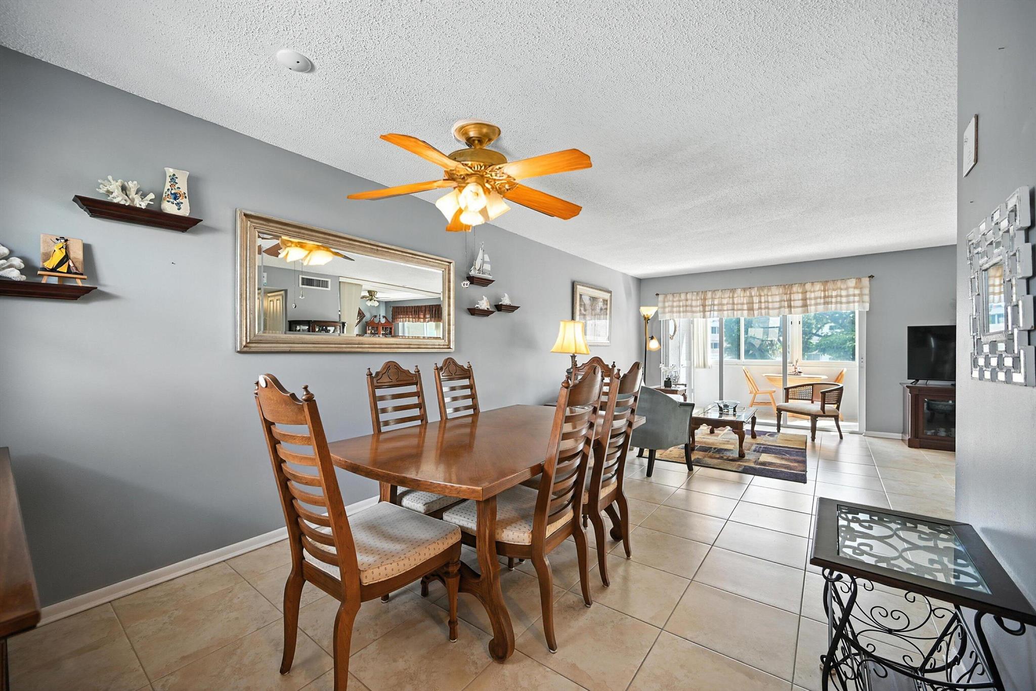 Welcome to your perfect Palm Springs retreat! This beautifully furnished Bahama model 1-bedroom, 1.5-bathroom condo offers comfort, convenience, and serene lakefront living in a vibrant 55+ community. The bright, open-concept layout is complemented by tile flooring throughout, partial impact windows, and tasteful upgrades. The updated kitchen features granite countertops and ample cabinet space, including additional hallway storage with pull-out drawers. The spacious primary suite includes a walk-in closet and a modern en-suite bathroom, offering both comfort and privacy. Enjoy your morning coffee with a stunning lake view right from your home. This well-maintained building offers resort-style amenities including two pools (one heated), a fitness center, billiards, bocce, mini-putt,