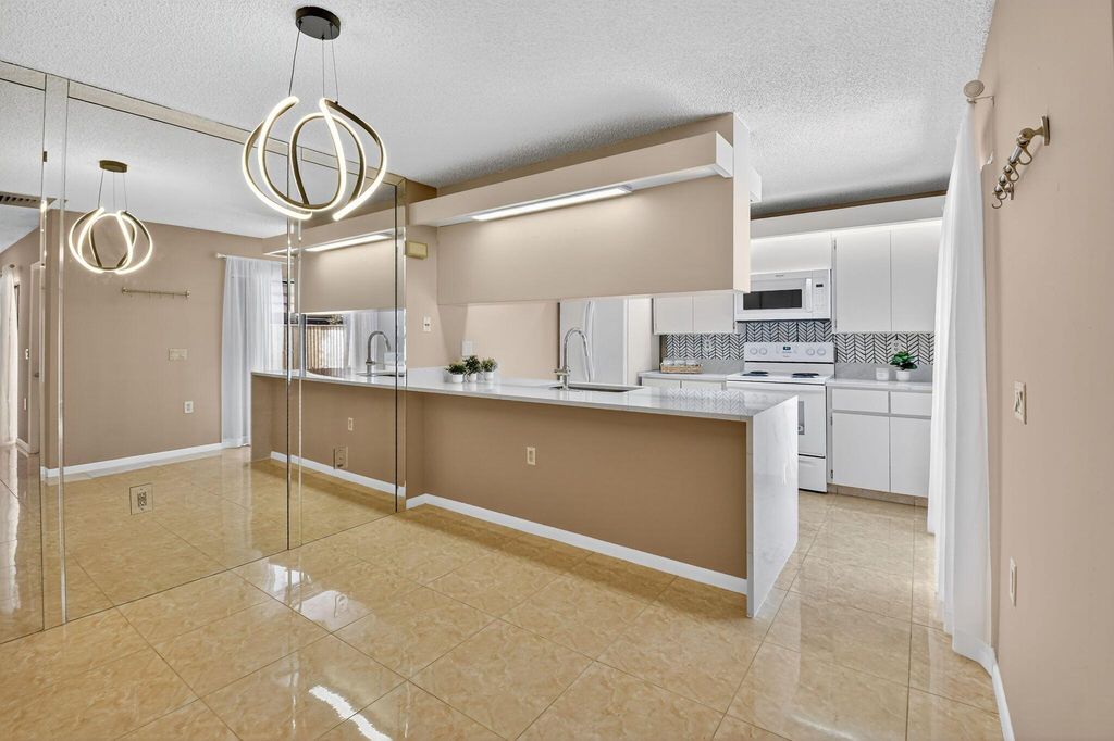 Photo of 413 Buttonwood Lane, Boynton Beach, FL 33436 (MLS # R11104082)