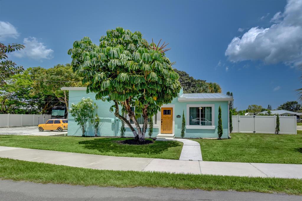 BRING YOUR TOYS - ALL YOUR TOYS! Double-lot on the corner of Golden Gate in Stuart. Electric, water, and sewer hookup for RV, room for your boat, shed with electric. RV is currently being monetized through AirBNB, home is being sold turnkey with same opportunity to monetize. NEW METAL roof 2022, fully remodeled kitchen w/ induction range, baths, new flooring, new electric panel, new custom cabinetry, new gutters, newly painted interior and exterior, no plastic plumbing - everything converted to copper! FULL IMPACT WINDOWS - MIAMI CAT 5 rated! Newly fenced-in backyard with fruiting mango, lime, lemon, and banana trees! If you are looking for a unique yet move-in ready, cozy home for yourself or as a tropical-style rental investment - look no further! Call to schedule a showing.