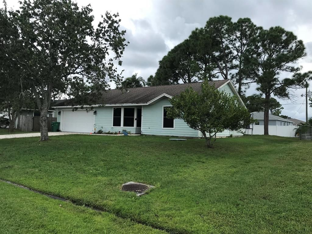 Photo of 1218 SE Manth Lane, Port Saint Lucie, FL 34983 (MLS # R10754514)