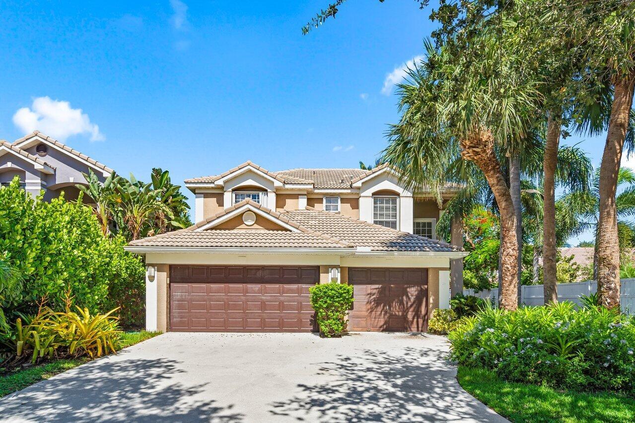 This waterfront 3 bed+loft+Office & 3 car garage family home is located in the prestigious gated Delray Lakes tennis & boating community in Delray Beach, FL. minutes from the famous Atlantic Ave A stunning two-story home, built in 2001, offering an impressive 2,468 square feet of living space and providing ample room for a comfortable family living. The spacious and private living areas are perfect for both relaxation and hosting guests, with large windows allowing natural light to flood the space, creating a warm and inviting atmosphere. The home's highlight is its 10 ft and 20Ft ceilings, the backyard oasis, featuring a swimming pool, a boat deck to the canal to escape to lake Ida and enjoy the Florida sunshine cooling off on hot days and enjoy serene waterfront lifestyle.