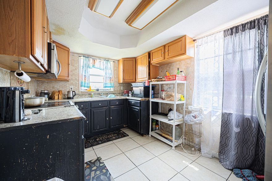 Investors are Welcomed!  Potential Galore!  Excellent Opportunity to own this spacious home.    4 bedrooms 3 bathrooms and a laundry room.  Lovely footprint including the large kitchen. Great location to downtown Ft. Lauderdale and the beaches.