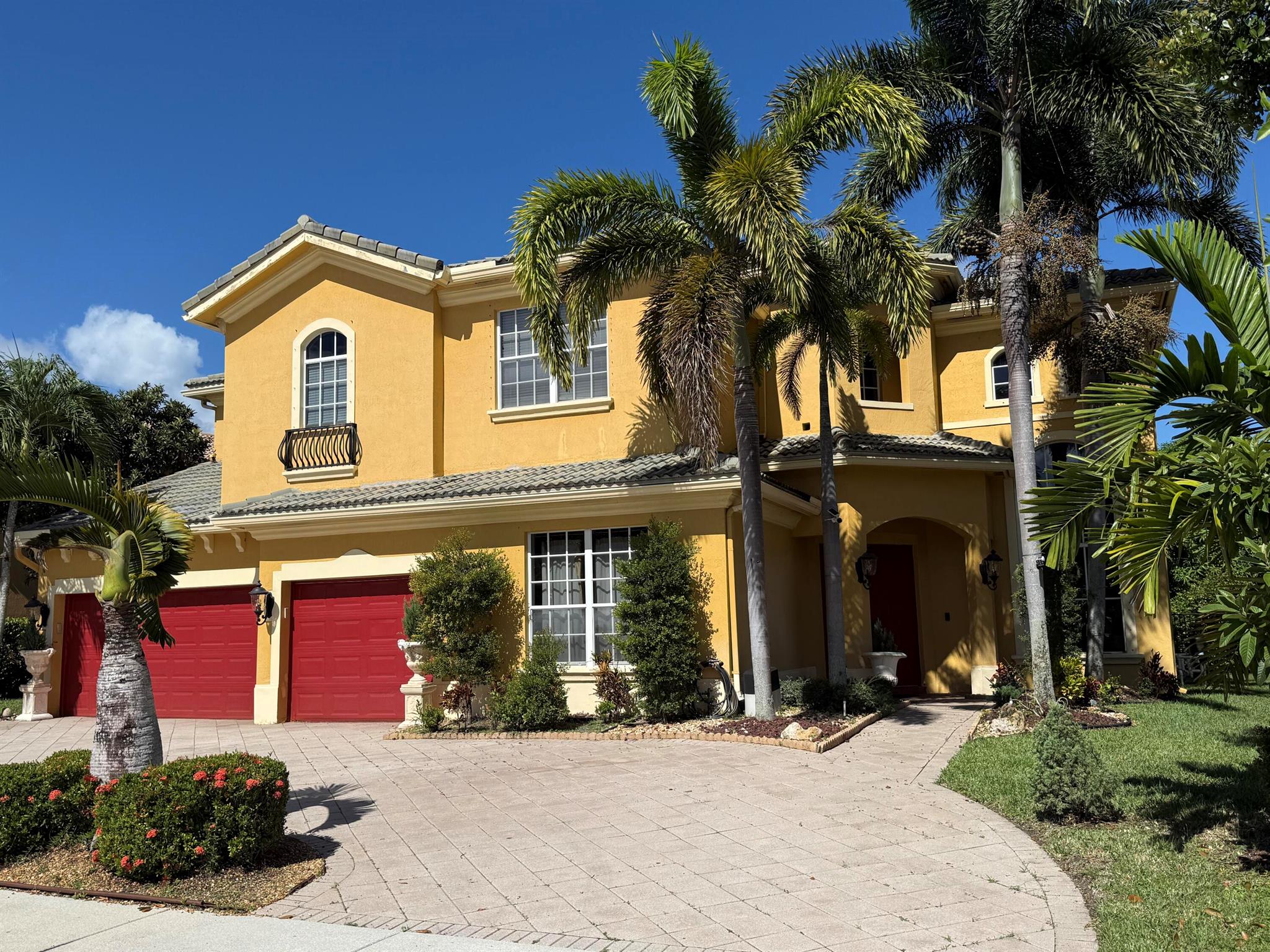 Live the South Florida lifestyle in this stunning 5-bedroom, 4-bath pool home located in the gated community of Countryside Estates. This residence combines elegant design with comfortable living in a serene lakefront setting. 1st floor bedroom. The primary suite with balcony, offers peaceful water views, dual walk-in closets, and a spa-style bath with soaking tub and glass-enclosed shower. Upstairs are 3 additional bedrooms. Covered patio for outdoor dining, lush tropical landscaping. Additional highlights include a 3-car garage, ample storage, and an inviting community with sidewalks and a secure gated entrance. Conveniently located near Top rated schools, equestrian venues, shopping, dining, and major highways. Schedule your private showing.