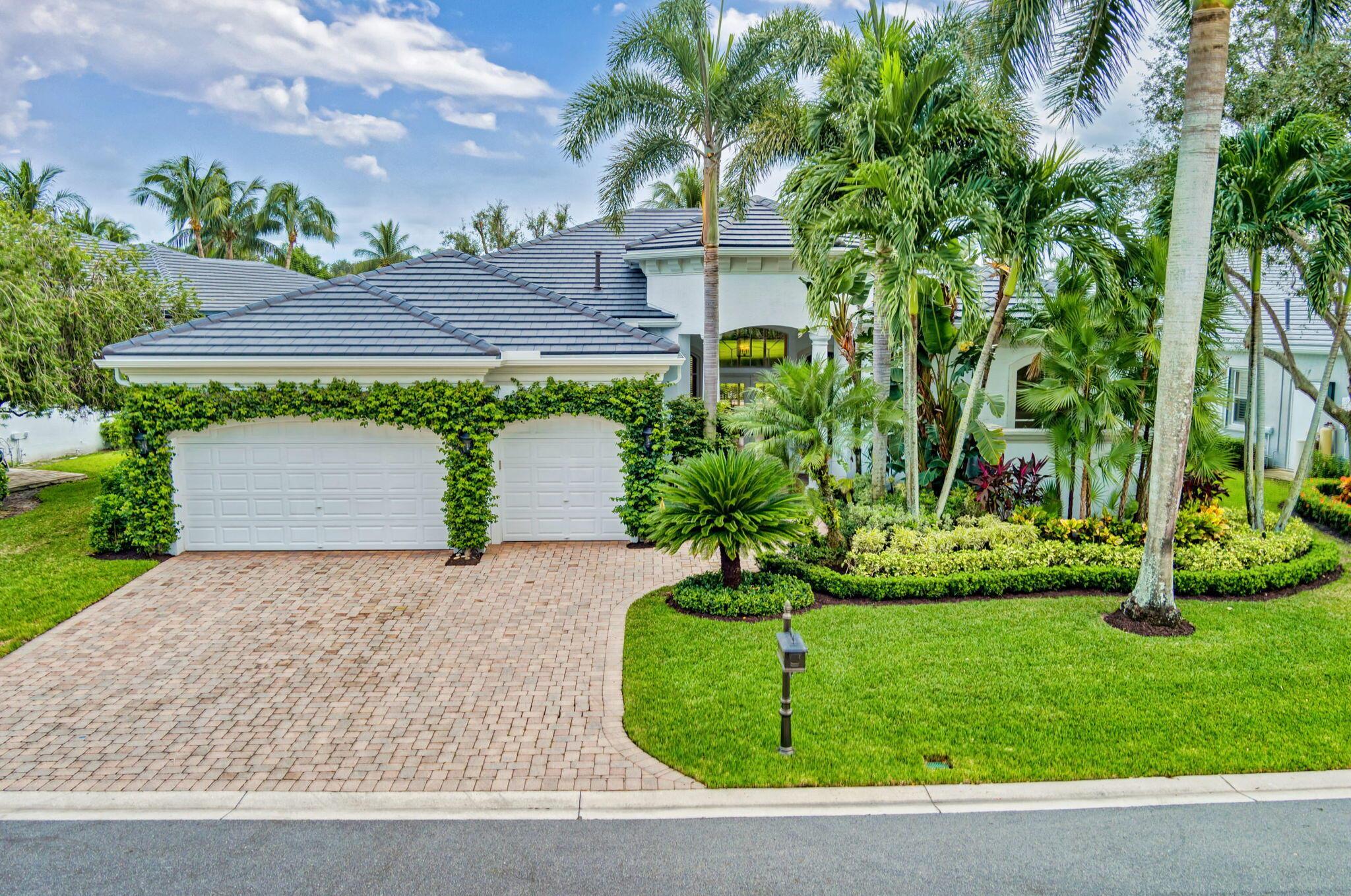 Welcome to this exquisite La Flora ranch-style residence in the highly coveted Vizcaya Estates community, nestled within the prestigious Country Club at Mirasol. This beautifully updated home offers a spacious 3,300 square feet of living space, featuring four en-suite bedrooms plus an office--a perfect layout for those seeking both style and functionality. Step inside to discover an open floor plan with abundant natural light, showcasing a freshly painted exterior in a chic white. The home boasts a brand-new flat tile roof, modern wood-style porcelain tile flooring, and an updated kitchen with elegant shaker cabinets, stone countertops, and premium Thermador appliances, including a built-in refrigerator.