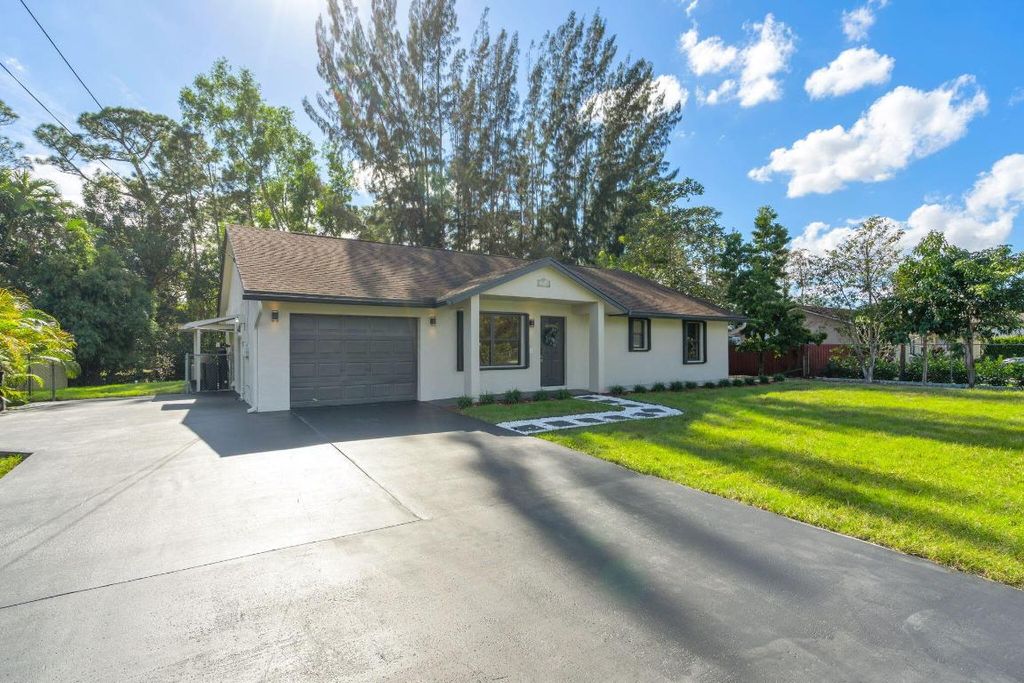 Photo of 15438 Los Angeles Drive, Loxahatchee Groves, FL 33470 (MLS # R11158890)