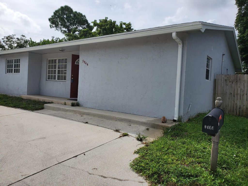 Photo of 3944 Melaleuca Lane, Lake Worth, FL 33461 (MLS # R11020250)