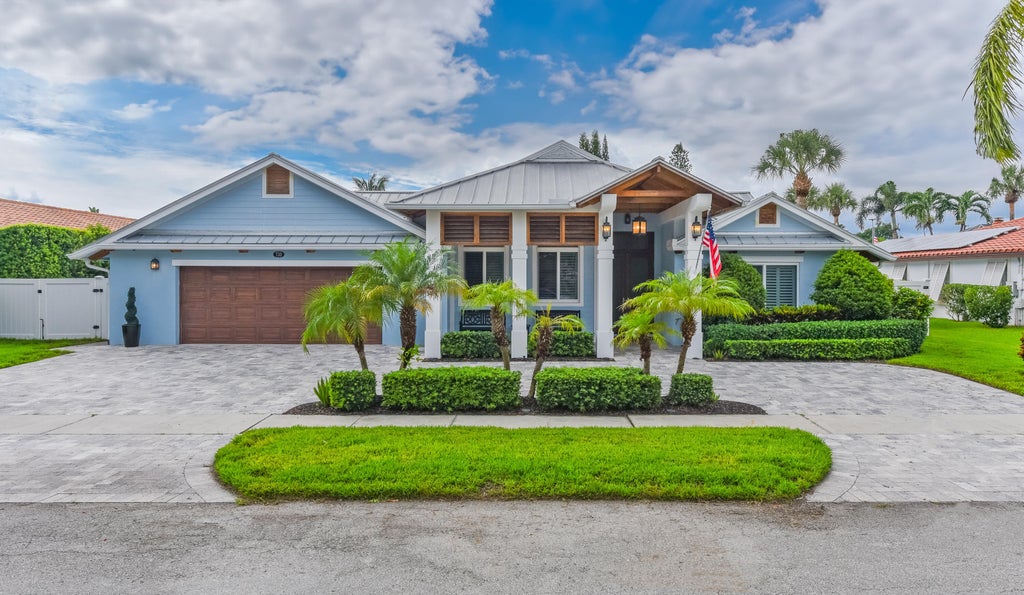 Photo of 730 CAMINO LAKES Circle, Boca Raton, FL 33486 (MLS # B26077920)