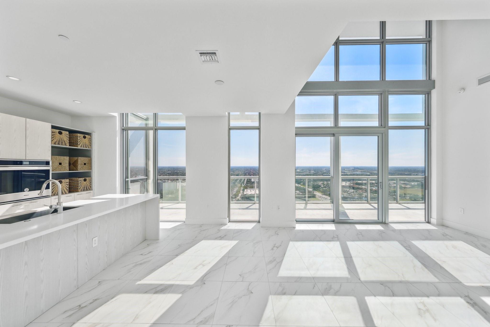 Experience modern elegance in this two-story penthouse at Metropica, offering floor-to-ceiling windows, open living spaces and an expansive private terrace with breathtaking views. Designed for sophistication, each residence features high-end finishes, European-style cabinetry, quartz countertops and premium appliances. The primary suite boasts a spa-inspired bath, dual vanities and a soaking tub, with additional rooms for guests or office space. Be the first to call this stunning, new penthouse home! Enjoy resort-style amenities, including a pool, fitness center, sauna, clubhouse, tennis courts, kids playroom and 24/7 security. Steps from Sawgrass Mills Mall, Amerant Arena, restaurants and major highways. Choose from four different penthouse floor plans. ASK ABOUT THE 5% DEVELOPER CREDIT!