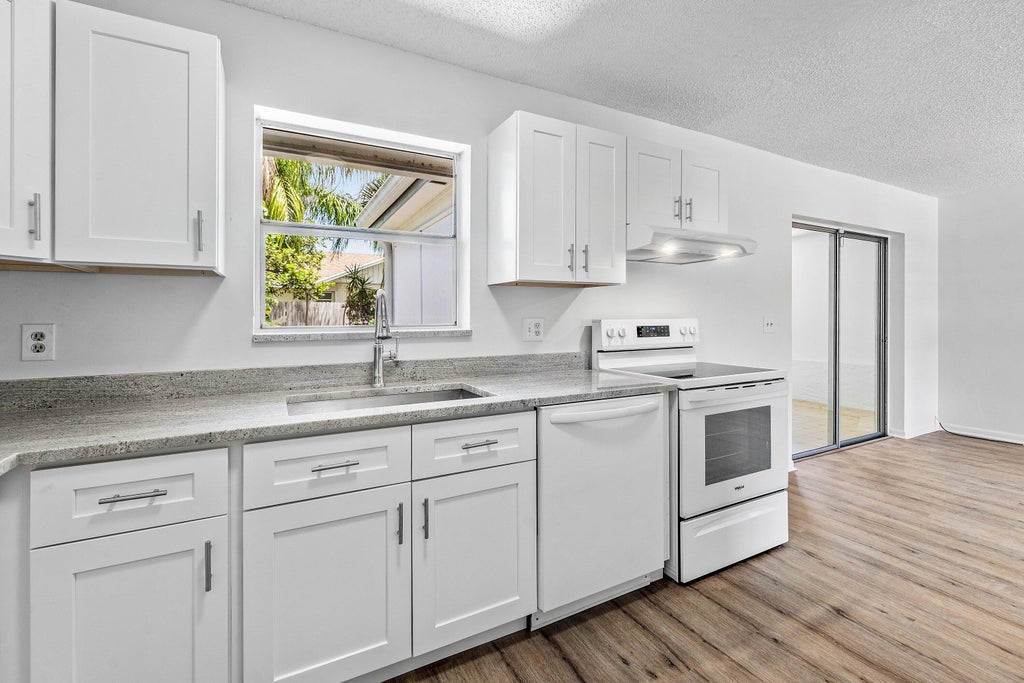 Photo of 149 Arrowhead Circle, Jupiter, FL 33458 (MLS # B26068639)